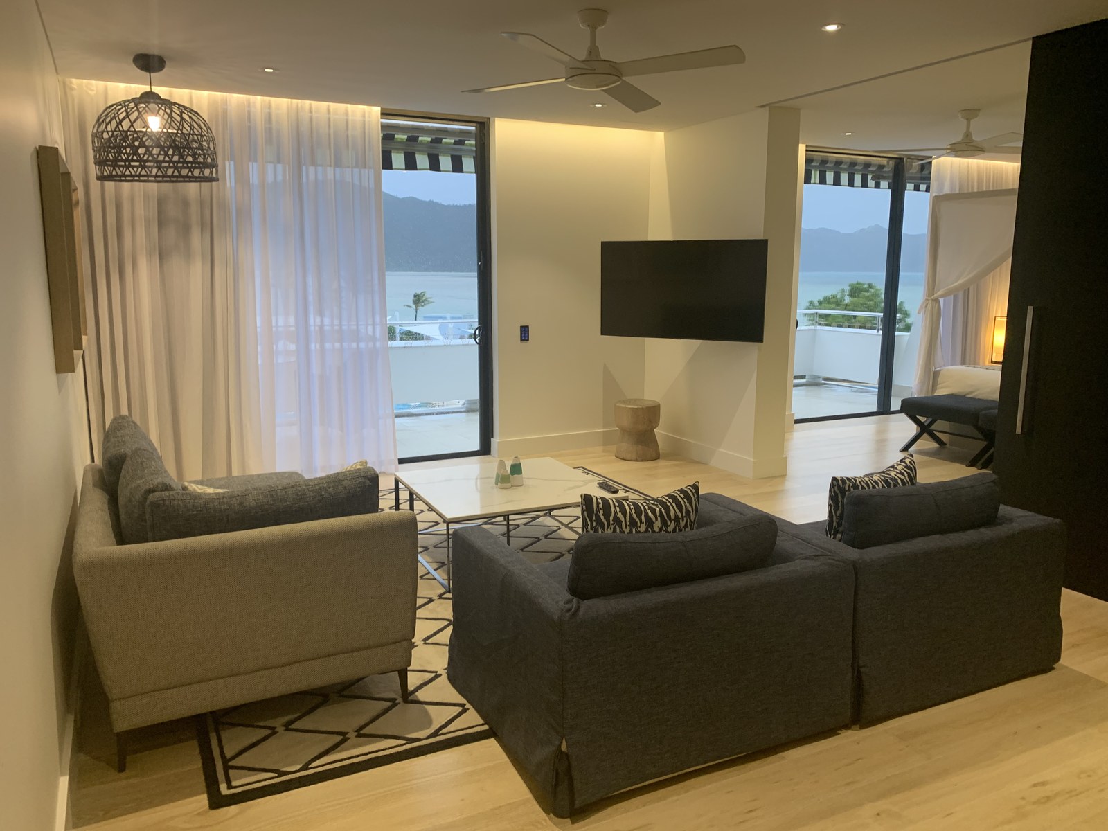 Living room with two glazed openings to the water